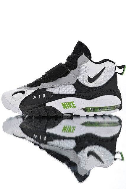 Black and gray running shoes with green Air-Sole accents, Nike swoosh, lace-up