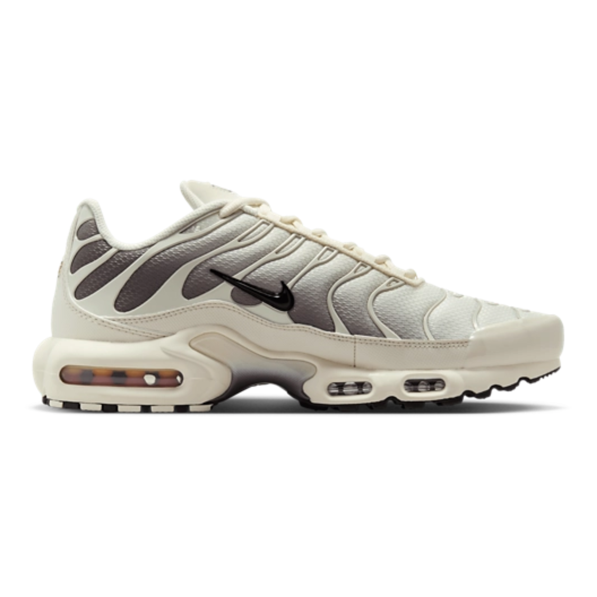 Nike Air Max Plus sneaker, light beige with black swoosh and wood-pattern midsole