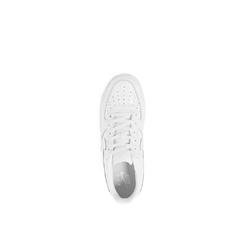White kids low-top Nike sneaker, top view of laces and perforated toe